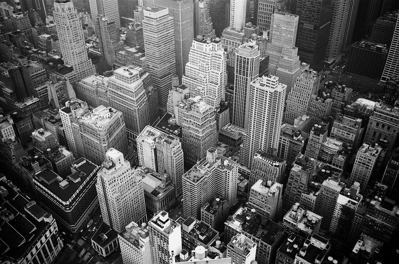 Aerial View and Grayscale Photography of High-rise Buildings